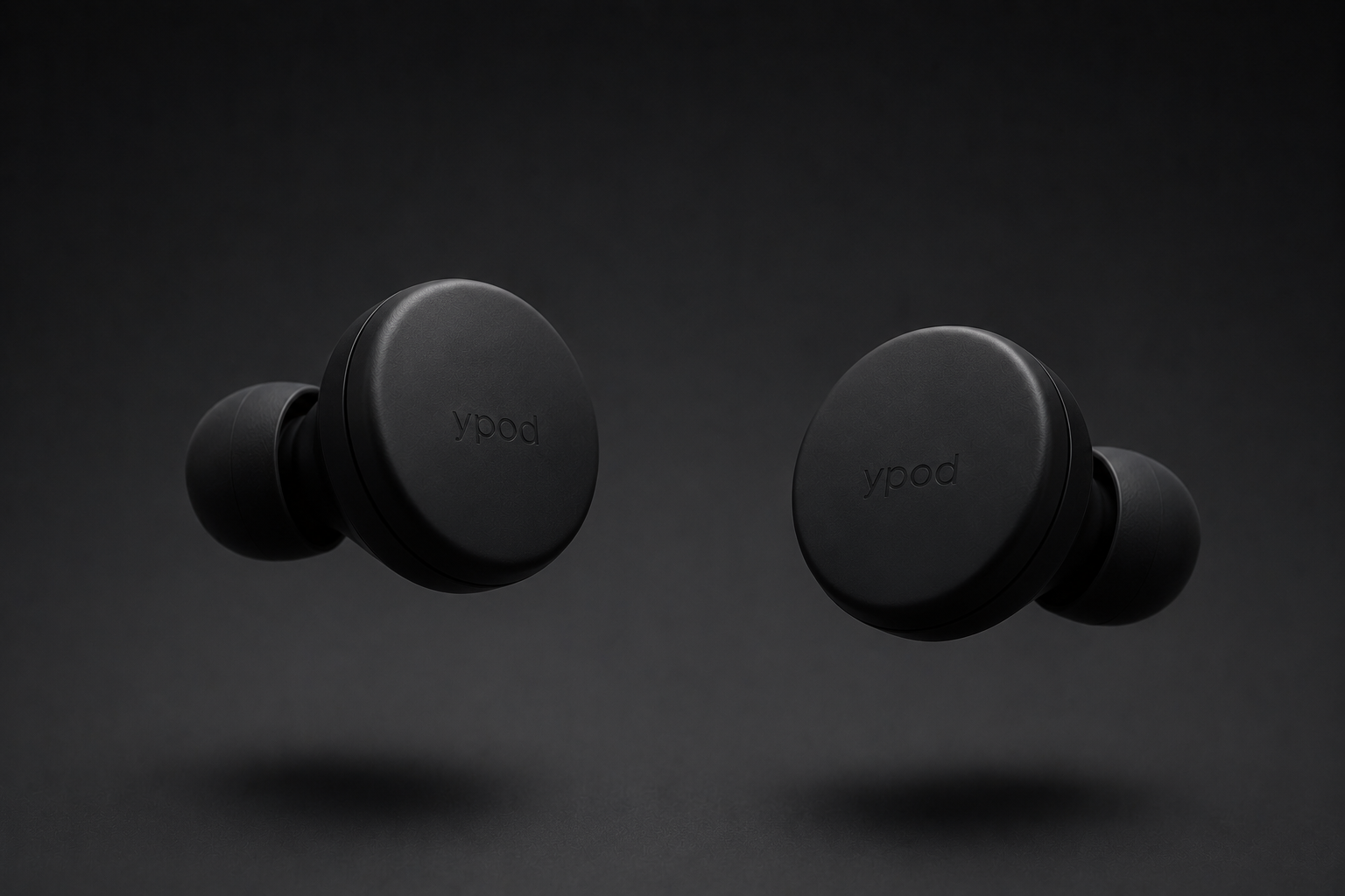 two circular matte black yema-1 earbuds on a white background